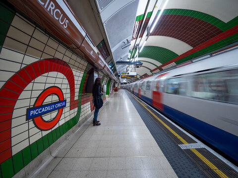 London - September 22, 2018: Train speeding up in city subway, London underground, public subway, Piccadilly cirkus. London, September 22, 2018, England
