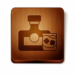 Brown Whiskey bottle and glass icon isolated on white background. Wooden square button. Vector