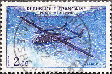 France - circa 1954: A post stamp from France showing your historic airplane with double tail system Nord 2501 Noratlas
