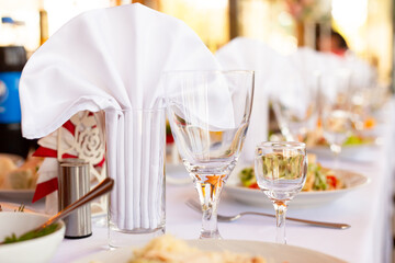 Glasses and napkins on a served table European Russian cuisine event holiday