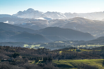 Fototapeta premium Winter landscape of southwestern France with the Pyrenees mountains in the background