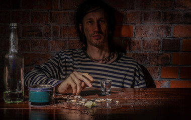 Black hair man with alcohol brown wooden table