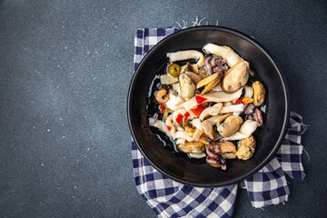 seafood mix salad squid, mussels, octopus, shrimps healthy meal food snack on the table copy space food background