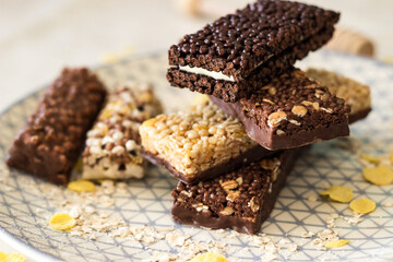 Granola energy bar with mix of nuts and fruits on a plate