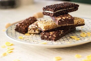 Granola energy bar with mix of nuts and fruits on a plate