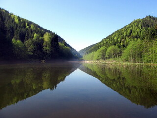 Fog over a mountain lake