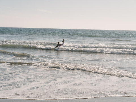 kids playing in surf