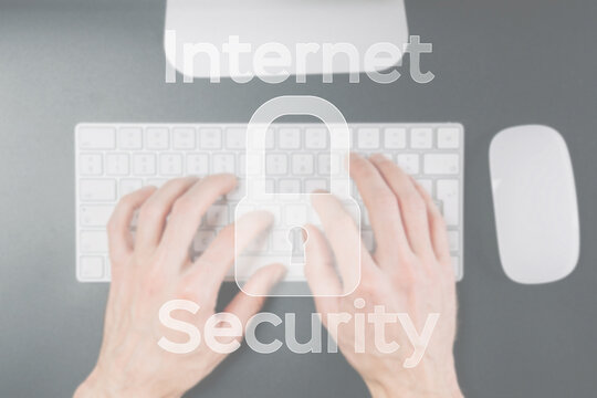 Internet security computer data symbol on blured keyboard background. Hacker attack and data breach, information leak concept.
