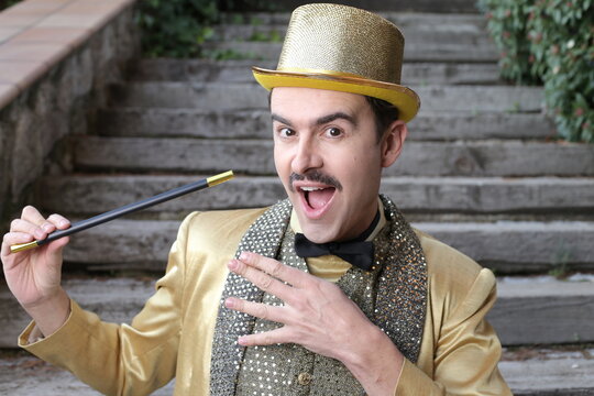 The greatest illusionist ever holding magic wand