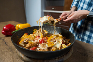 frying pan with meat and vegetables. Healthy food.