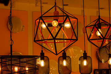 contemporary chandelier, a branched ornamental light fixture designed to be mounted on ceilings or...