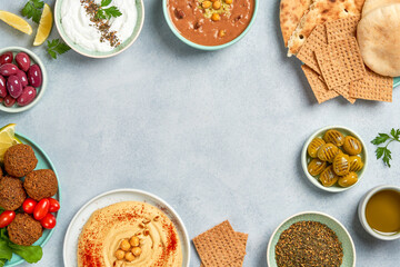 Middle eastern, arabic traditional breakfast with hummus, foul, falafel and zaatar. Top view