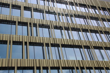 Building with mirrored walls. Facade of building made of mirror fragments