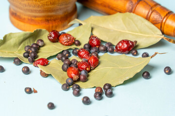 wood mortar and pestle, with daphnia Leaf, herbal, wild rose, hawthorn black