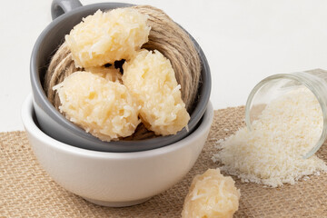 Traditional coconut candy (cocada) in a cup.