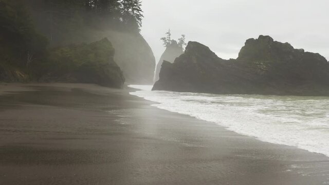 Dramatic view pf the Pacific Ocean as seen from above. Drone footage of astonishing, scenic landscape, where the mountains meet the sea. High quality 4k footage