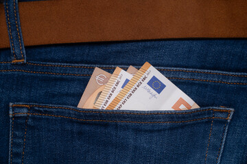 Money in blue jeans pocket