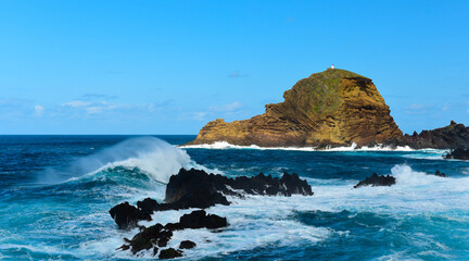 Fototapeta na wymiar The north shore of Madeira. Porto Moniz lighthouse.