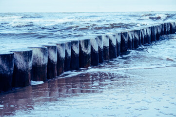 Wooden groyne on a sea