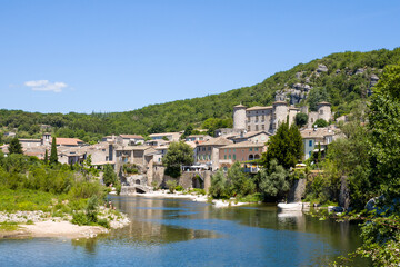 The town of Vogue in the middle of the Ardeche gorges in Europe, France, Ardeche, in summer, on a sunny day.
