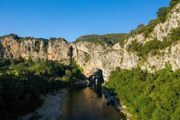 Fototapeta na wymiar The panoramic view from Pont dArc in the Ardeche gorges in Europe, France, Ardeche, in summer, on a sunny day.