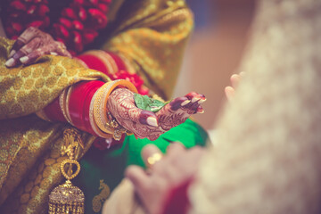 Indian Hindu wedding ceremony ritual items, hands and feet close up