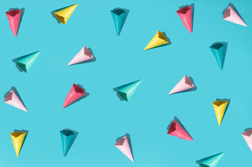 Ice cream cones pattern. Turquoise background. Sweet, summer minimal concept idea. Top view. Flat lay
