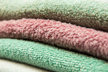 multicolored towels close up. personal hygiene concept. fleecy colorful background.