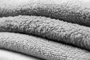 grey towels close up. personal hygiene concept. fleecy light background.