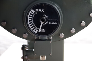 monitor oil pressure and oil level in a conservator tank