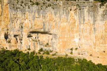 Holes in the cliffs of the Gorges de lArdeche in Europe, France, Ardeche, in summer, on a sunny day.