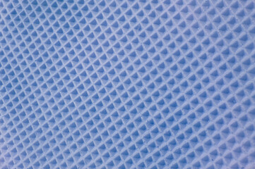 waffle cake close up. blue checkered background. geometric volumetric texture.