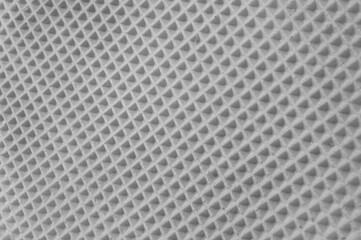 waffle cake close up. grey checkered background. geometric volumetric texture.
