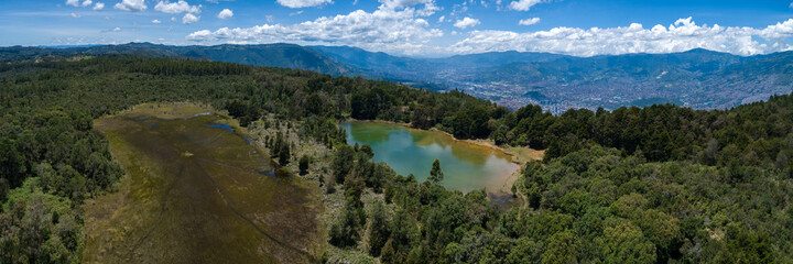 Fototapeta na wymiar Unreal Green Forest, Wetland and Blue Guarne Lagoon near Medellin, Antioquia Colombia