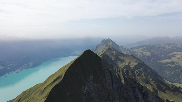 Amazing footage over the beautiful places in Switzerland. A wonderful areal flight at a sunny day in the alps. Epic drone flight over the beautiful mountains at the lake Brienz called Brienzergrat.