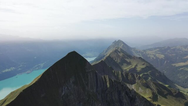 Amazing footage over the beautiful places in Switzerland. A wonderful areal flight at a sunny day in the alps. Epic drone flight over the beautiful mountains at the lake Brienz called Brienzergrat.