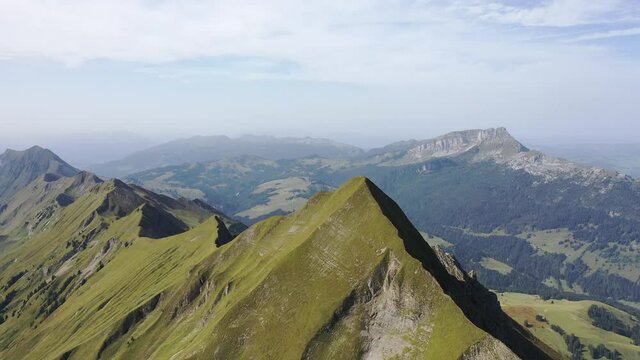 Amazing footage over the beautiful places in Switzerland. A wonderful areal flight at a sunny day in the alps. Epic drone flight over the beautiful mountains at the lake Brienz called Brienzergrat.