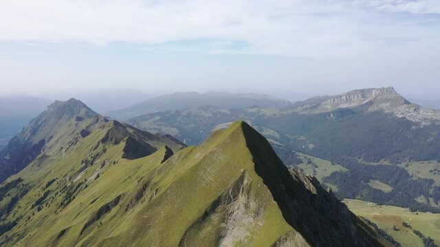 Amazing footage over the beautiful places in Switzerland. A wonderful areal flight at a sunny day in the alps. Epic drone flight over the beautiful mountains at the lake Brienz called Brienzergrat.