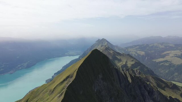 Amazing footage over the beautiful places in Switzerland. A wonderful areal flight at a sunny day in the alps. Epic drone flight over the beautiful mountains at the lake Brienz called Brienzergrat.