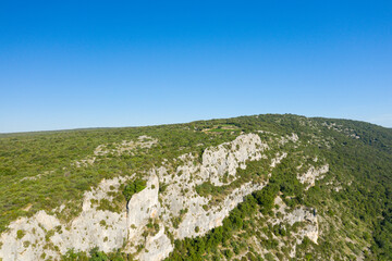 Fototapeta na wymiar The rocky cliffs in the middle of the Ardeche countryside in Europe, France, Ardeche, in summer, on a sunny day.