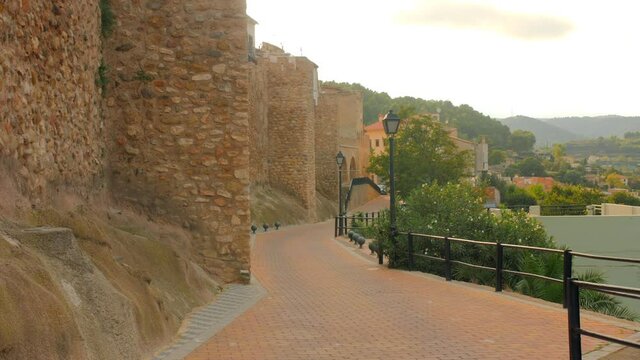 Segorbe, province of Castellon, Spain - August 2021. Promenade near the Medieval Wall Of The Castle Of Alcazar On The Slopes Of Sopena.