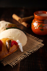 Traditional Kings day cake also called Rosca de Reyes, roscon, Epiphany Cake and with a clay Jarrito. Mexican tradition on January 5th