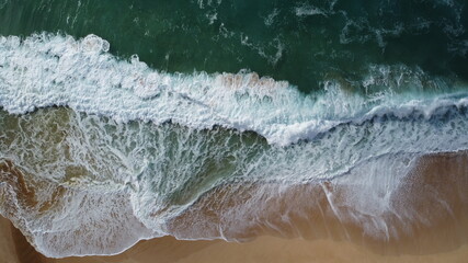 Crashing Waves on Hawaii Beach Bird's eye view drone