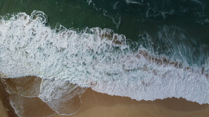 Crashing Waves on Hawaii Beach Bird's eye view drone