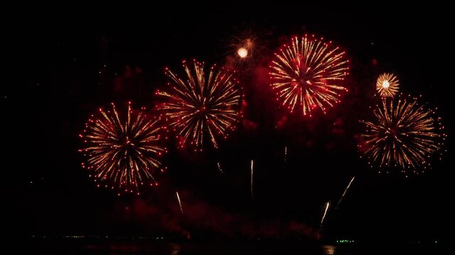 Footage B roll of Real Fireworks on night backgrounds. abstract  real shining fireworks with bokeh lights in the night sky. Celebration fireworks festival and New year's eve. Colorful fireworks.