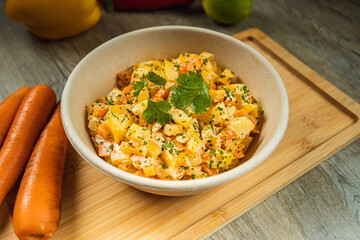 I LOVE FOOD SERIES. Latin American food on a wooden table with fresh, healthy and natural ingredients, such as corn, red pepper, and salad.