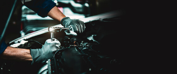 Fototapeta Car care maintenance and servicing, Close-up hand technician auto mechanic using the wrench to repairing change spare part car engine problem. Concepts of check and during periodic inspection service. obraz