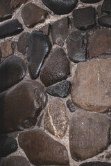 wall covered with natural stone. lacquered natural stone.