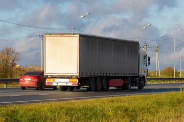 Truck with container on highway, cargo transportation concept. Shaving effect. Truck transportation.