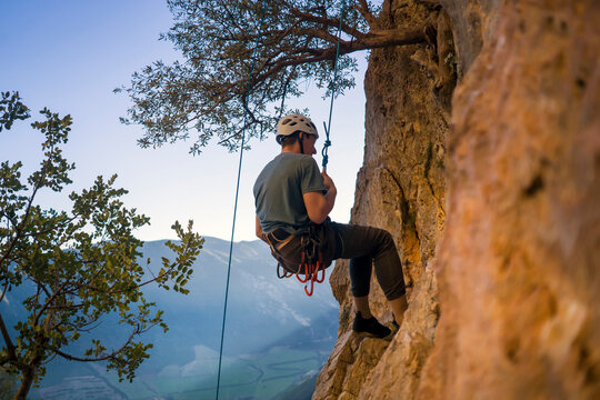 Man is climbing, hiking in the mountains.